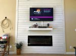 satTV and Fireplace/Heater on Wall